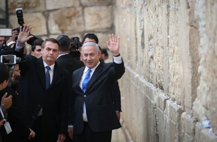Prime Minister Benjamin Netanyahu with Brazilian President Jair Bolsonaro at the Western Wall on April 1, 2019. (photo credit: YONATAN ZINDEL/FLASH 90)