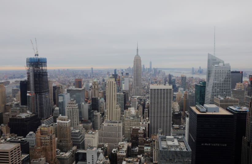 The Empire State Building rises above New York, U.S., January 23, 2019 (photo credit: REUTERS/LUCAS JACKSON)