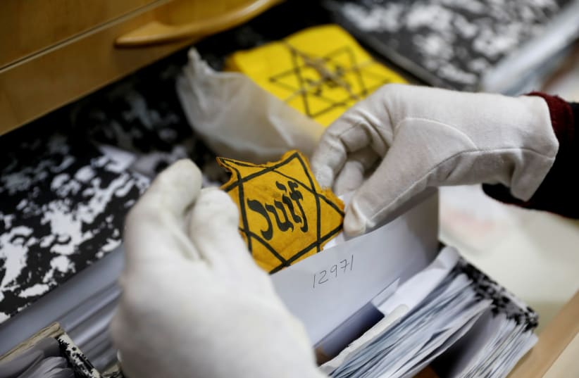 An original yellow star (not on general display) is seen at the artifacts department of the Yad Vashem World Holocaust Remembrance Center in Jerusalem, ahead of the Israeli annual Holocaust Remembrance Day, April 10, 2018 (photo credit: REUTERS/Ronen Zvulun)