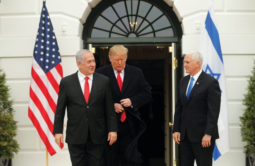 US PRESIDENT Donald Trump adjusts his jacket as he welcomes Prime Minister Benjamin Netanyahu with Vice President Mike Pence at the White House last month. Trump has dispelled any vestige of Palestinian trust in American intentions (photo credit: REUTERS/CARLOS BARRIA)