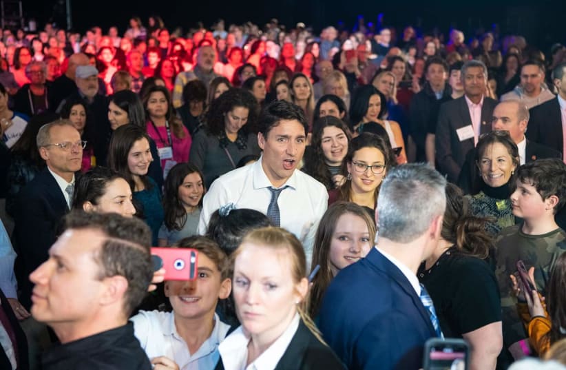 Canadian Prime Minister Justin trudeau sings along at a mass sing-along event  (photo credit: LIORA KOGAN AND ISAACIMAGE)
