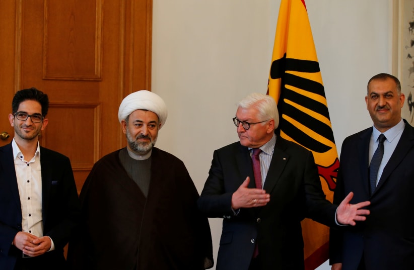 German President Frank-Walter Steinmeier welcomes Chairman of Islamic Community of Germany Sheikh Mahmood Khalilzadeh and Dawood Nazirizadeh, as he meets representatives of the Islamic communities of Shiites at Bellevue Palace in Berlin, Germany, April 30, 2018 (photo credit: REUTERS/AXEL SCHMIDT)