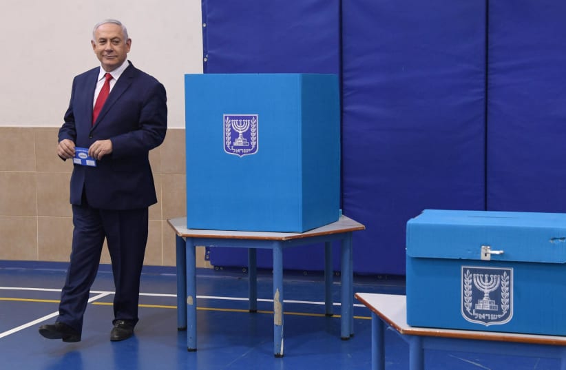 Prime Minister Benjamin Netanyahu voting at the elections (photo credit: HAIM ZACH/GPO)