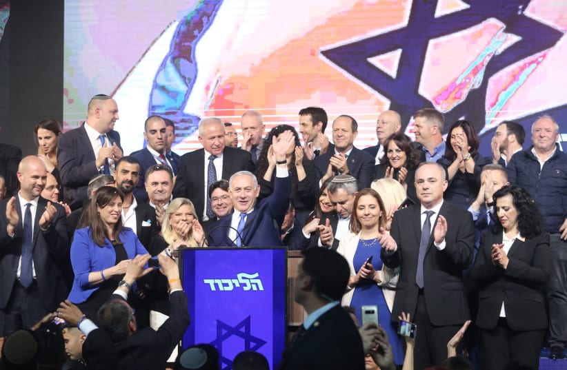Prime Minister Benjamin Netanyahu declares victory at a Likud party rally early on April 10, 2019 (photo credit: MARC ISRAEL SELLEM)