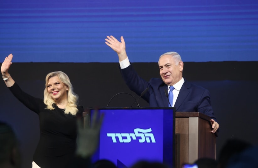 Prime Minister Netanyahu and his wife Sara greet supporters as Netanyahu at the Likud post-election celebration. (photo credit: MARC ISRAEL SELLEM)
