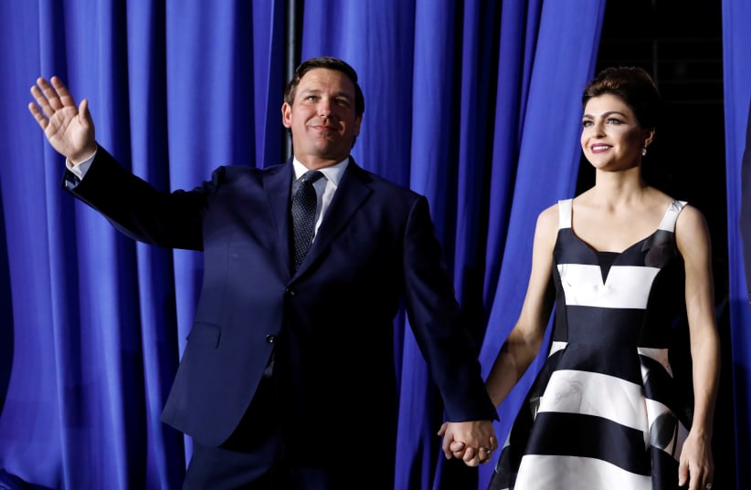 Florida Governor Ron DeSantis arrives with his wife Casey to hear U.S. President Donald Trump to speak about the crisis in Venezuela at Florida International University in Miami, Florida, U.S., February 18, 2019 (photo credit: KEVIN LAMARQUE/REUTERS)