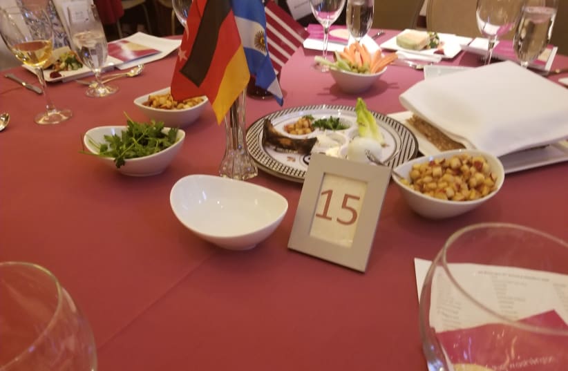 The Seder plate at the annual AJC mock Seder for diplomats in Washington, on April 11, 2019 (photo credit: OMRI NAHMIAS)