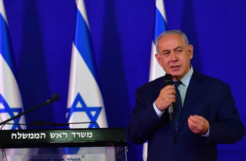 Prime Minister Benjamin Netanyahu speaking at a social event for Passover  (photo credit: KOBI GIDEON/GPO)