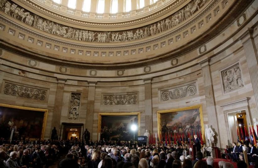 U.S. President Donald Trump delivers the keynote address at the U.S. Holocaust Memorial Museum's "Days of Remembrance" ceremony in the The Capitol Rotunda on Capitol Hill, in Washington, DC (photo credit: REUTERS/YURI GRIPAS)
