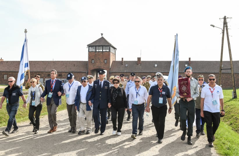 The FIDF delegation marches into Auschwitz-Birkenau in 2018. (photo credit: SHAHAR AZRAN)