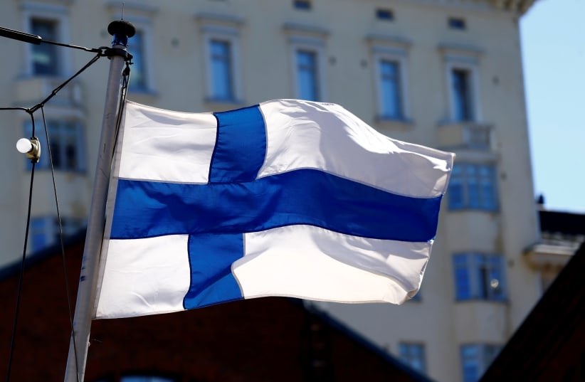 Finland's flag flutters in Helsinki, Finland, May 3, 2017 (photo credit: INTS KALNINS / REUTERS)