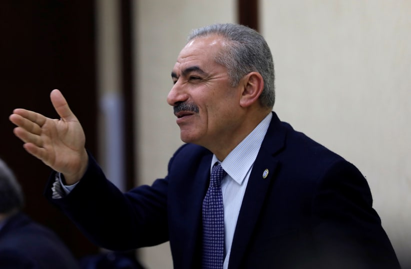 Mohammad Shtayyeh gestures during a Palestinian leadership meeting in Ramallah, in the Israeli-occupied West Bank February 20, 2019.  (photo credit: MOHAMAD TOROKMAN/REUTERS)