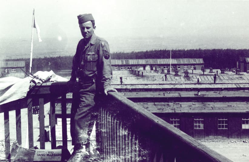 A SOMBER PFC Victor Geller overlooking the newly liberated Buchenwald, May, 1945. (photo credit: VICTOR GELLER PRIVATE COLLECTION)