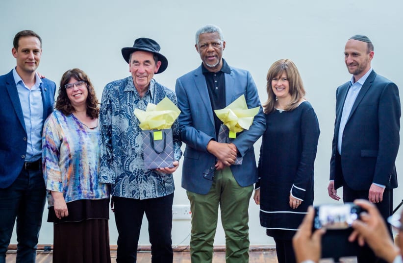 Members of South Africa's Jewish Communal leadership pose with anti-apartheid stalwarts Justice Albie Sachs and Mavuso Msimang. (photo credit: PHOTOGRAPHY BY ALON)