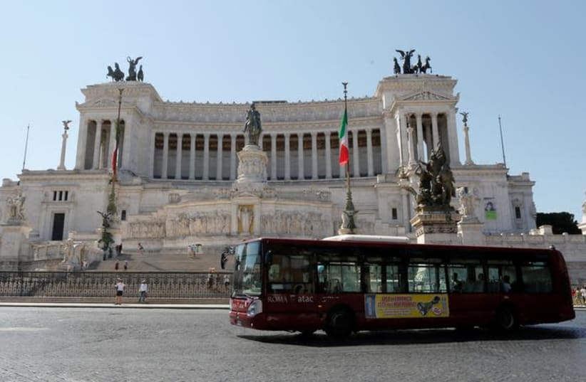 A public bus is seen in downtown Rome, Italy (photo credit: REUTERS/TONY GENTILE)