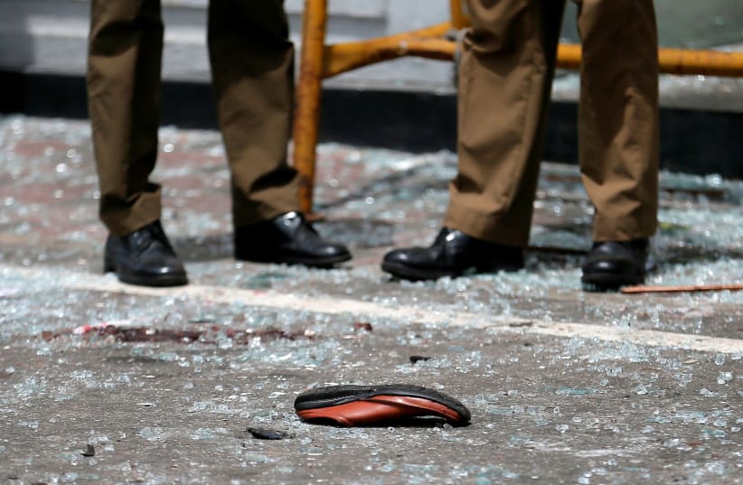 A shoe of a victim is seen in front of the St. Anthony's Shrine, Kochchikade church after an explosion in Colombo, Sri Lanka April 21, 2019 (photo credit: DINUKA LIYANAWATTE/REUTERS)