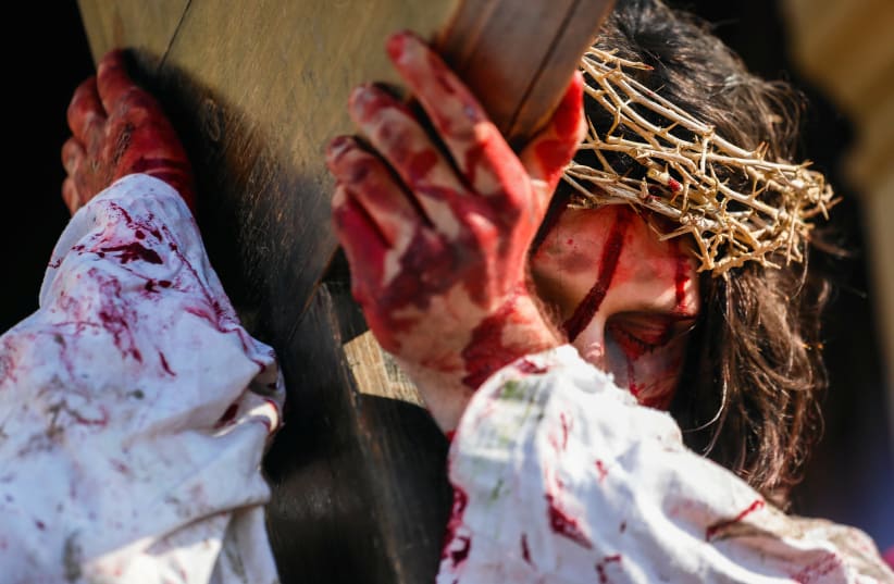 An actor portraying Jesus Christ takes part in Passion Play as part of Good Friday celebrations at the Sanctuary of Kalwaria Zebrzydowska near Krakow, Poland April 19, 2019. (photo credit: AGENCJA GAZETA/ADRIANNA BOCHENEK VIA REUTERS)