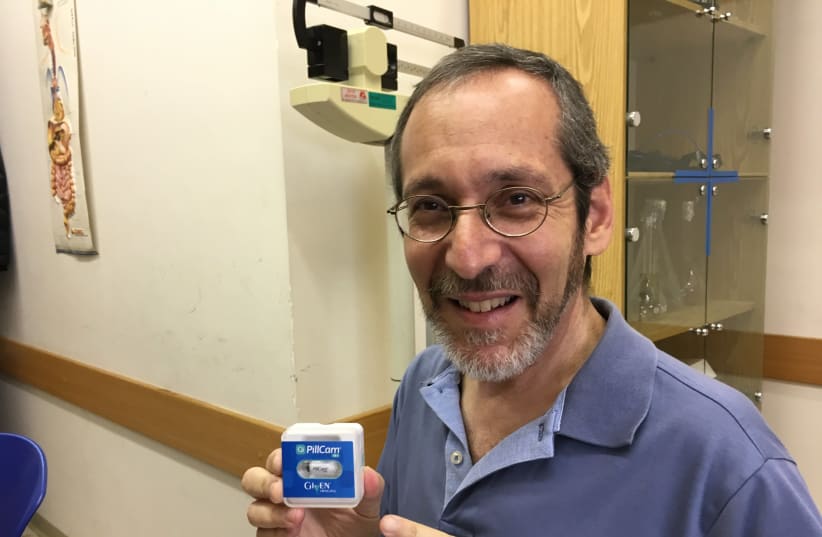 Writer Brian Blum with the PillCam unit, a Start-Up nation success story (photo credit: Courtesy)