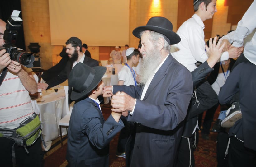 Rabbi Amiram Blau dancing at Bar Mitzvah program in the Jerusalem International Convention Center (photo credit: COLEL CHABAD)