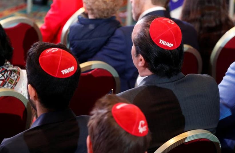 Men wear Trump yarmulkes while waiting for U.S. President Donald Trump to address the Republican Jewish Coalition 2019 Annual Leadership Meeting in Las Vegas (photo credit: REUTERS/KEVIN LAMARQUE)