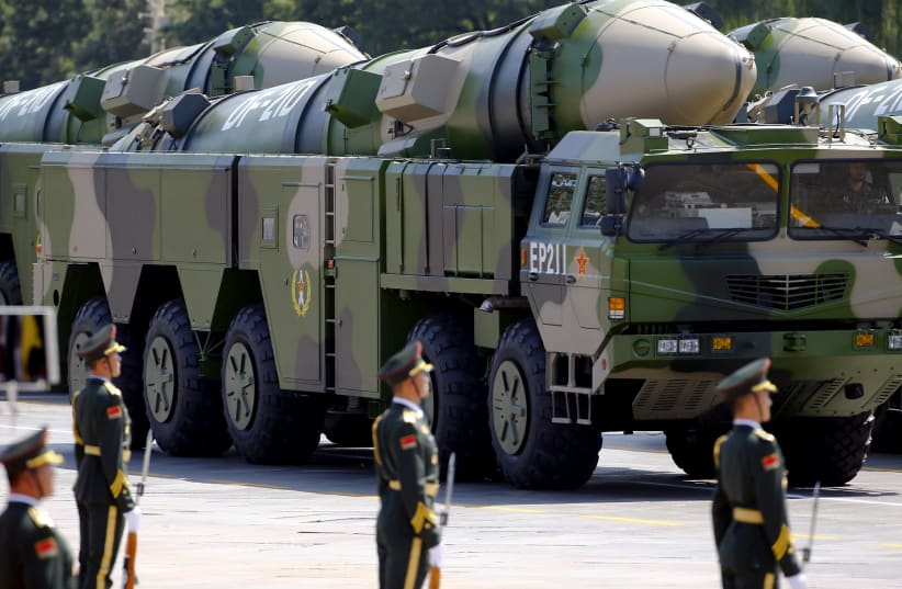 FILE PHOTO - Military vehicles carrying DF-21D ballistic missiles roll to Tiananmen Square during a military parade to mark the 70th anniversary of the end of World War Two, in Beijing, China, September 3, 2015 (photo credit: DAMIR SAGOLJ/ REUTERS)