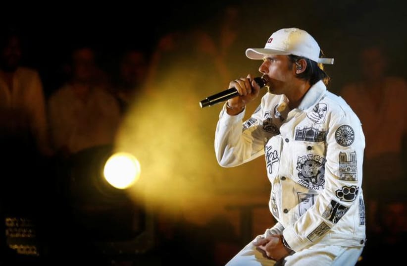 French rapper performing (photo credit: REUTERS/ERIC GAILLARD)
