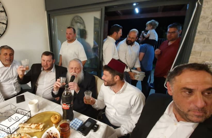 United Right MK Bezalel Smotrich [with the red fez] and Samaria Regional Council Head Yossi Dagan [L] at a celebration of the feast of Mimouna.     (photo credit: ROEE HADI)