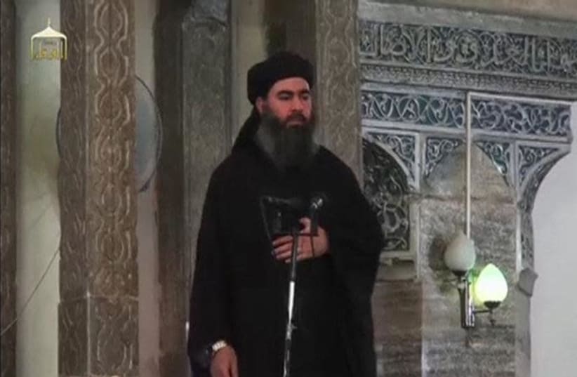 A man purported to be the reclusive leader of the militant Islamic State Abu Bakr al-Baghdadi (photo credit: REUTERS)