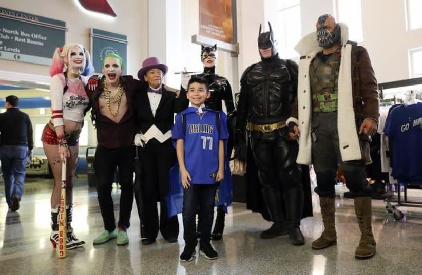 Feb 10, 2019; Dallas, TX, USA; Dallas Mavericks fan poses with comic book characters on superhero day before the game against the Portland Trail Blazers at American Airlines Center. (photo credit: KEVIN JAIRAJ-USA TODAY SPORTS)