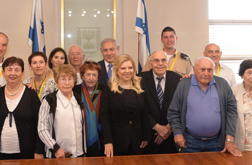 Holocaust survivors meet Benjamin and Sara Netanyahu ahead of Yom HaShoah, April 30, 2019 (photo credit: NIR SHERF / GPO)