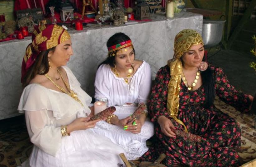 A family of Romanian witches use a video call to contact a client in India paying for a love spell, in Mogosoaia near Bucharest, Romania (photo credit: REUTERS/EMILY WITHER)