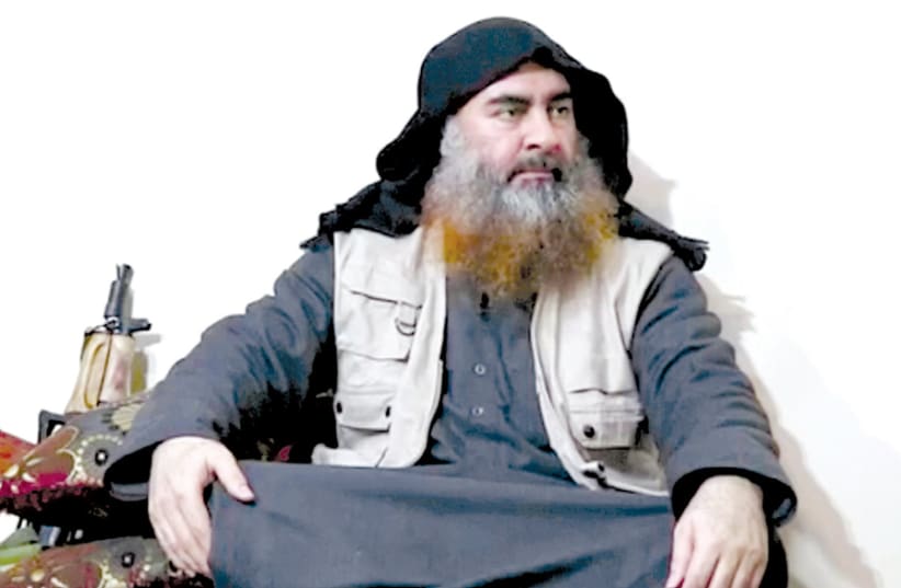 A MAN purported to be Islamic State leader Abu Bakr al-Baghdadi speaks in this screen grab taken from video released on April 29. (photo credit: REUTERS)