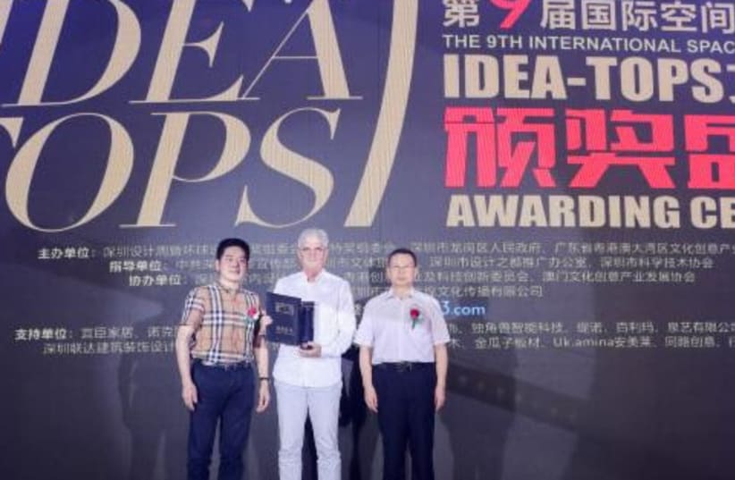 Architect Etan Kimmel accepting two awards at the 9th annual International Space Design Award Idea-Tops in Shenzhen, China, April 25, 2019 (photo credit: Courtesy)