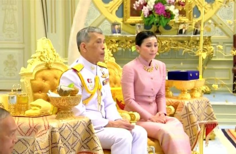 King Maha Vajiralongkorn and his consort, General Suthida Vajiralongkorn named Queen Suthida attend their wedding ceremony in Bangkok, Thailand (photo credit: REUTERS)