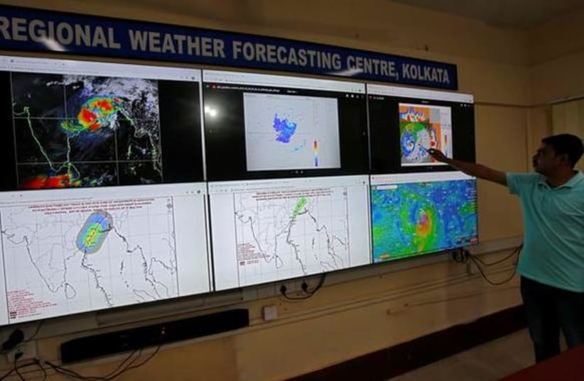 Debapriya Roy, a scientist at India Meteorological Department Earth System Science Organisation, monitors Cyclone Fani inside his office in Kolkata, India (photo credit: REUTERS/RUPAK DE CHOWDHURI)