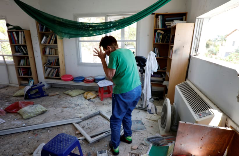 Yael Nisinbaum reacts after house near the Gaza border was struck by a rocket fired into Israel on May 4, 2019 (photo credit: AMIR COHEN/REUTERS)