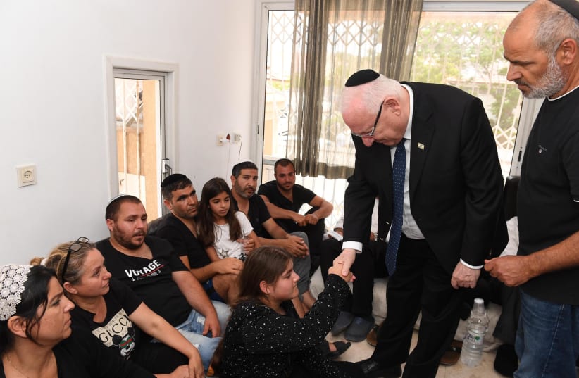 President Rivlin visiting family of Moshe Agadi killed in rocket attack in south of Israel. (photo credit: MARK NEIMAN - GPO)
