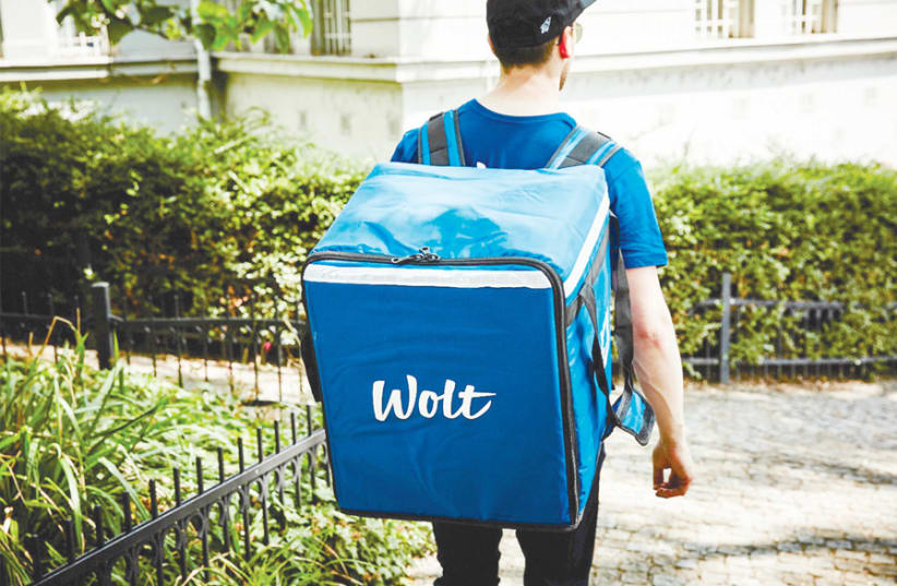 TO SUPPLEMENT his income, Gal Beckman works as a messenger for Wolt, a Finland-based online food ordering and delivery service that recently began operating in central Tel Aviv. (photo credit: PR)