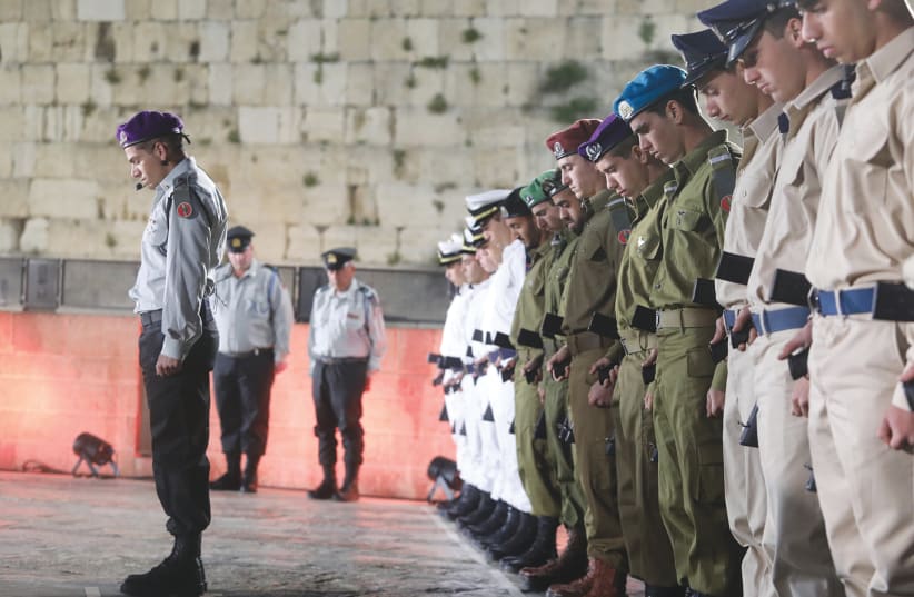 SOLDIERS STAND STILL as the memorial siren is sounded nationwide yesterday, during a ceremony marking Remembrance Day at the Western Wall. (photo credit: MARC ISRAEL SELLEM)