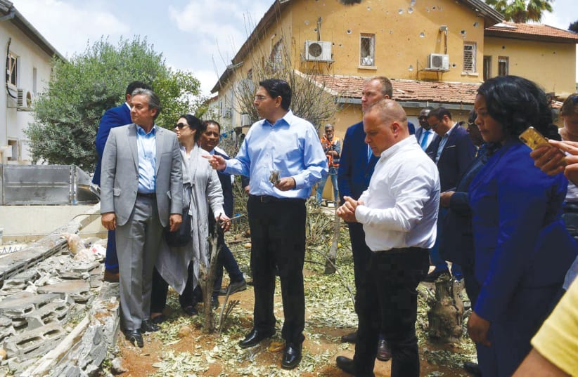 ISRAEL’S AMBASSADOR to the UN Danny Danon leads a delegation of UN ambassadors on a tour  of Ashkelon to view damage from last weekend’s rockets.  (photo credit: PERMANENT MISSION OF ISRAEL TO THE UN)