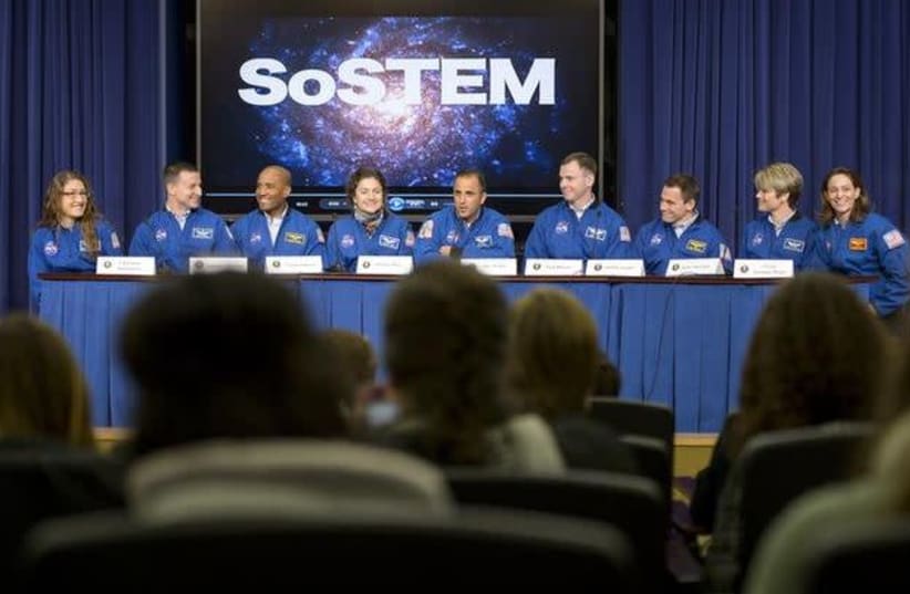 NASA Astronaut Joe Acaba (C), moderates a panel discussion with NASA's 2013 astronaut candidates, (L-R), Christina M. Hammock, Andrew R. Morgan, Victor J. Glover, Jessica U. Meir, Tyler N. "Nick" Hague, Josh A. Cassada, Anne C. McClain, and, Nicole Aunapu Mann, at the annual White House State of Sci (photo credit: BILL INGALLS / REUTERS)