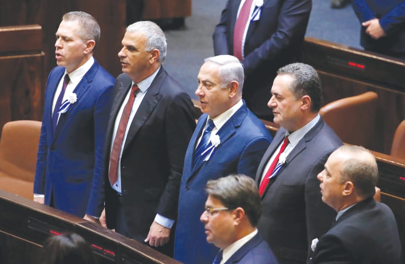 PRIME MINISTER Benjamin Netanyahu and current cabinet ministers sing ‘Hatikvah’ during the inauguration ceremony of the 21st Knesset last month.  (photo credit: RONEN ZVULUN/REUTERS)
