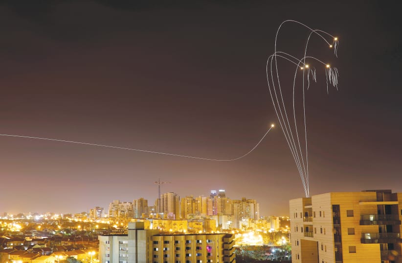 THE IRON DOME air defense system fires interceptor missiles over Ashkelon on Sunday. (photo credit: AMIR COHEN/REUTERS)