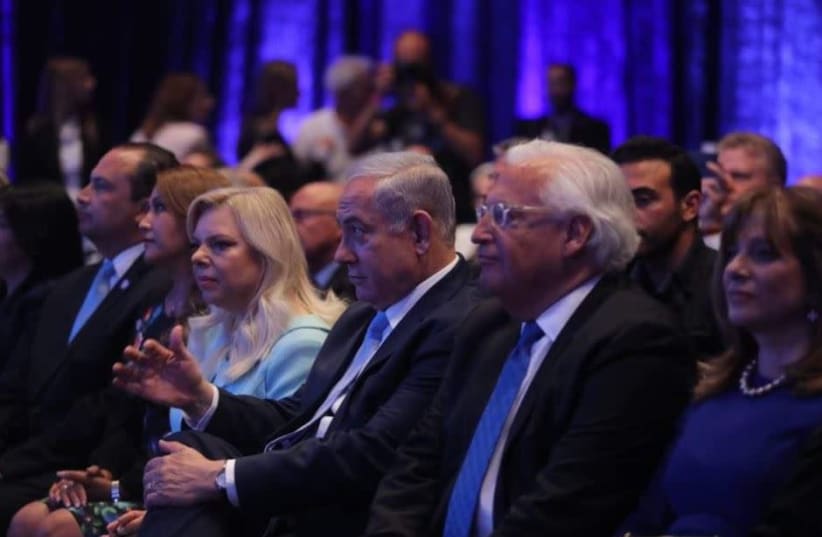 Prime Minister Benjamin Netanyahu [C] and wife Sarah [L] next to US Ambassador in Israel David Friedman [R] (photo credit: MARC ISRAEL SELLEM)