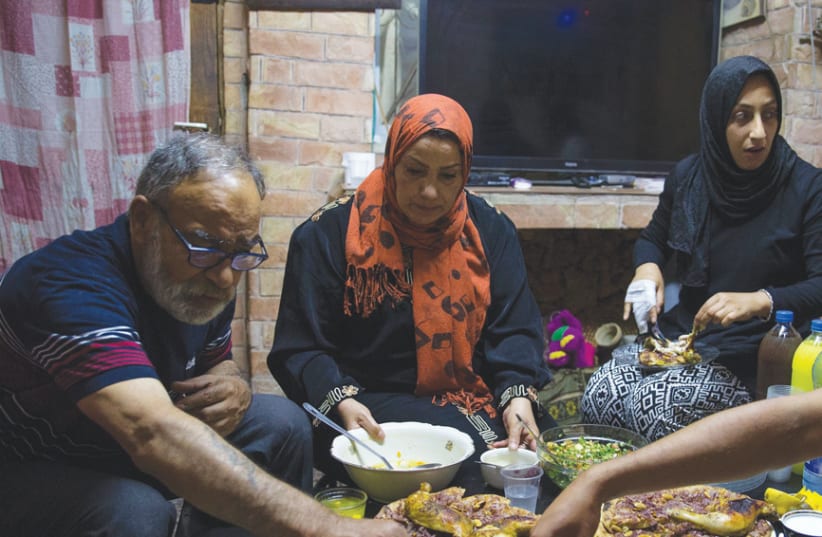 JEWISH ISRAELIS get some firsthand experience of the Iftar sunset meal. (photo credit: ITAI LITMAN)