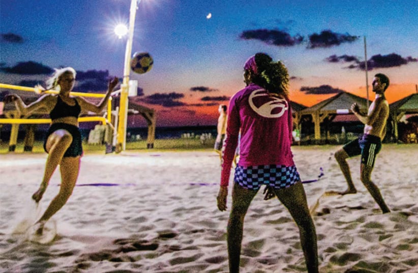 PLAYERS KICK a ball around on the beach in Tel Aviv. (photo credit: BORIS BELENKIN)