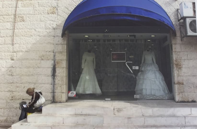 HEDDY ABRAMOWITZ’S photo of a Jerusalem bridal salon. She said the work is meant to show the contrast between the dream of a new marriage and the reality of the mundane. (photo credit: MAAYAN HOFFMAN)