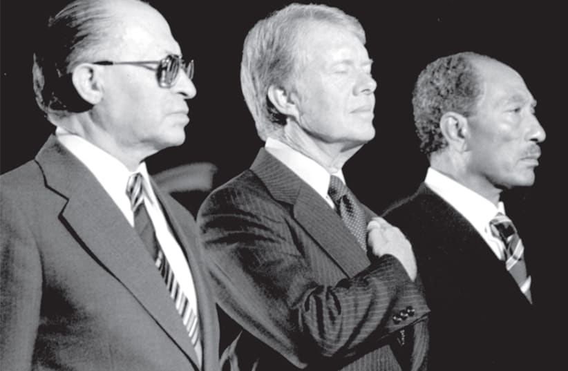 MENACHEM BEGIN, Jimmy Carter and Anwar Sadat at a Marine Corp Ceremony on September 7, 1978. (photo credit: COURTESY THE JIMMY CARTER LIBRARY)