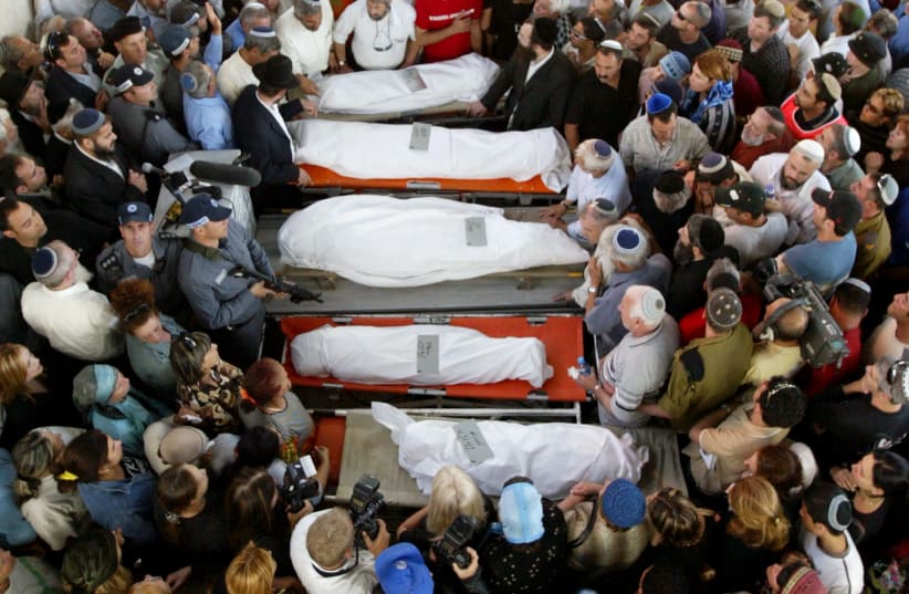 A general view shows the five bodies of the Hatuel family, the pregnant mother Tali and her four daughters. (photo credit: REUTERS)