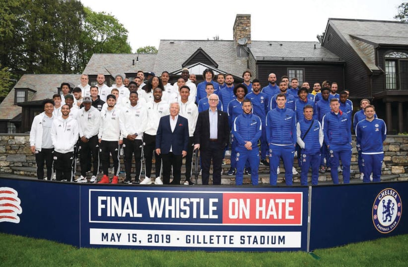 Robert Kraft (left), owner of the New England Revolution and Bruce Buck, chairman of Chelsea FC, pose in front of their teams this week.  (photo credit: CHELSEA FOOTBALL CLUB)